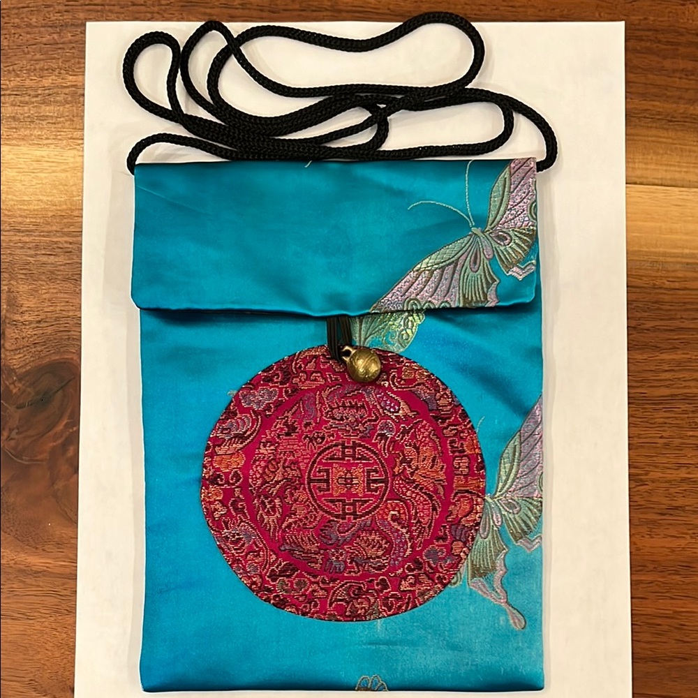 Elegant Turquoise Silk Bag with Red Embroidery